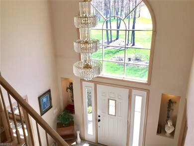 Two story foyer with lighted niches and guest clos