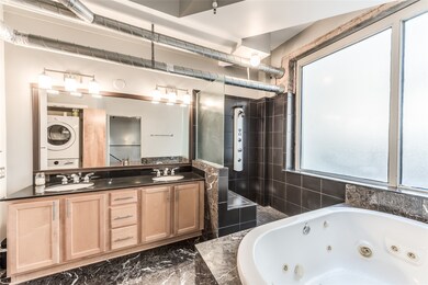 Over sized, jetted tub is perfect for relaxation.