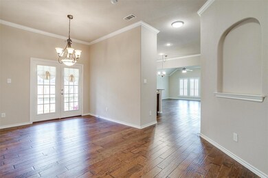 Spare room featuring dark wood-type flooring, ceil