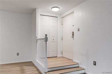 A view of the entrance with coat closet