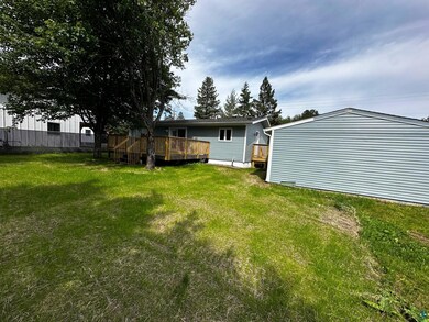 View of yard with a wooden deck
