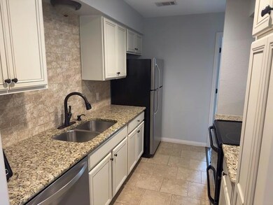 Kitchen featuring appliances with stainless steel