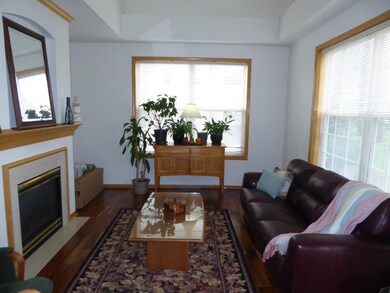 Living room is filled with light and sun-filled wi