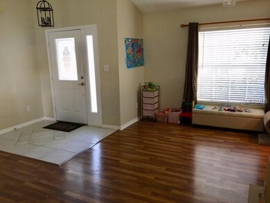 Foyer and dining area with Pergo wood floors