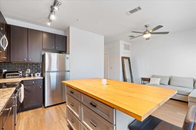Kitchen featuring appliances with stainless steel
