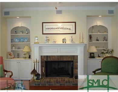 Living Room. Elegant mantle with raised brick hear