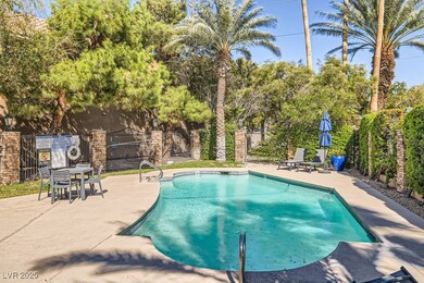 View of swimming pool featuring a patio area, a fe