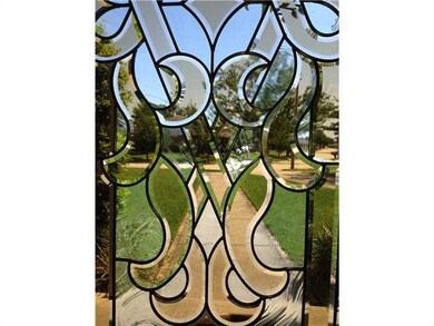 Foyer. Leaded glass entryway door.