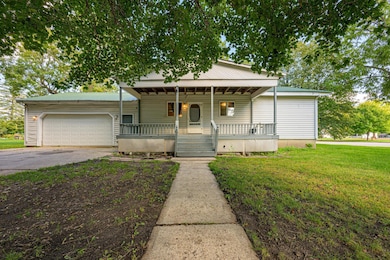 A spacious covered porch sits at the front of the home.