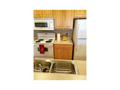 Kitchen. Breakfast bar/pass thru makes it easy to 
