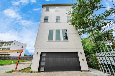 Modern multi-story home with a sleek exterior, fea