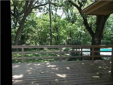 Sliding doors to deck overlooks pool