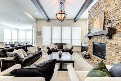 Cedar wrapped wood beams in living/family room wit
