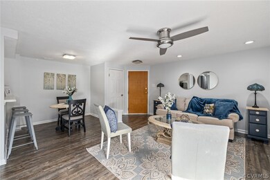 Living room with dark hardwood / wood-style floors
