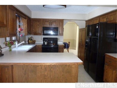 The spacious, open kitchen includes plenty of oak 