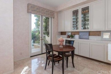 Breakfast area with many cabinets and French doors