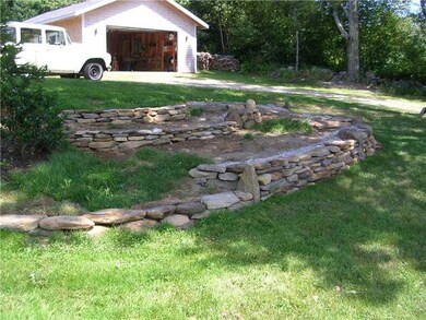 Exterior Front. Garage and landscaping.