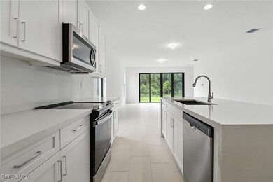Kitchen with appliances with stainless steel finis