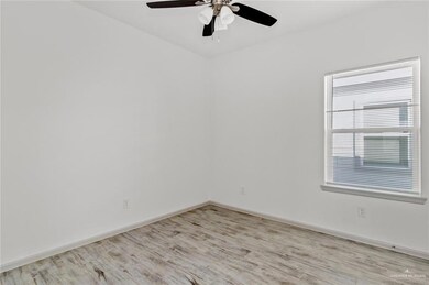 Unfurnished room featuring light wood-style floors and a ceiling fan
