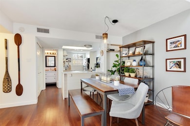 Dining space with baseboards, visible vents, and 