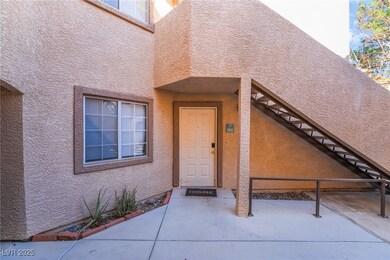 View of exterior entry with stucco siding