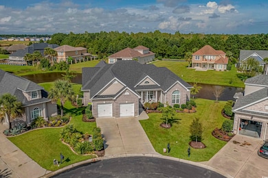 Aerial view of residential area featuring a nearby body of water