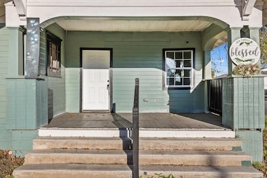 View of exterior entry featuring a porch