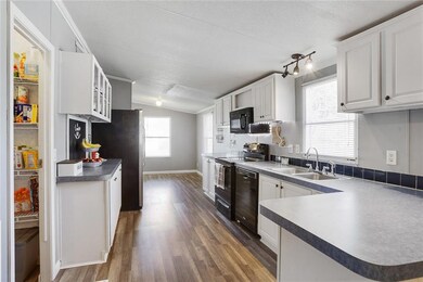 Coffee station with upper cabinetry and a pantry
