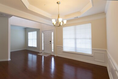 View of front living area from the formal dining room