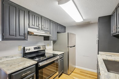 Updated kitchen with stainless steel appliances.