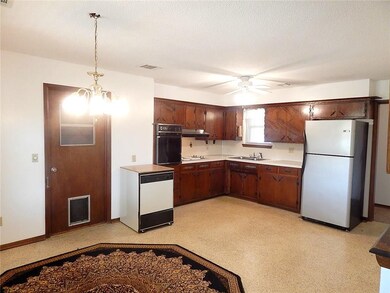 Spacious kitchen with built in oven and range, lot