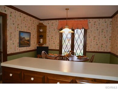 Breakfast nook in the kitchen has a window overloo