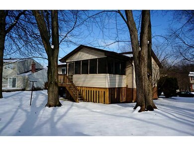 Exterior Back. The screened in back porch provides