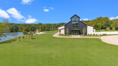 Surrounding community with a lawn and a water view