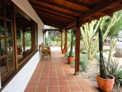Covered Front Porch Runs Length of Home