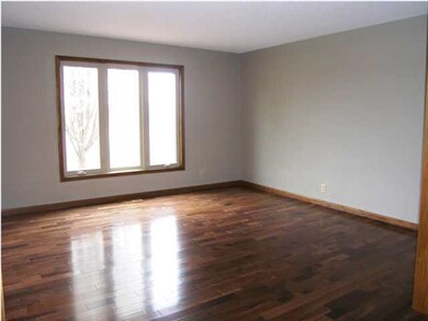 THE LIVING ROOM HAS NEW HICKORY SOLID WOOD FLOORIN