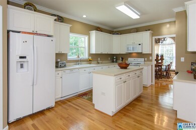 Pretty white kitchen with great cabinet space, cou