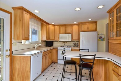 An inviting eat in kitchen was remodeled with Mapl