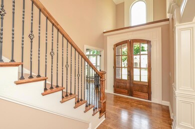 Gleaming hardwoods meet you in this warm foyer. Office to the right as you enter and dinning to left