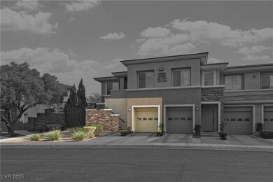 View of property with driveway, stone siding, and
