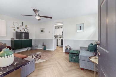 Living room featuring light parquet flooring and c