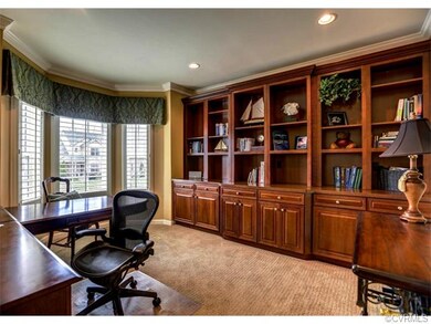 Study with built-in cherry bookcases and water vie