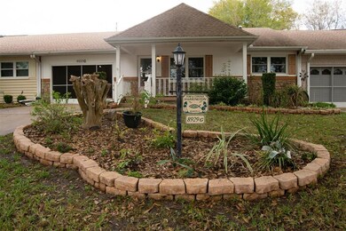 Front of Home with Flower Beds 