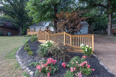 View of yard with a wooden deck