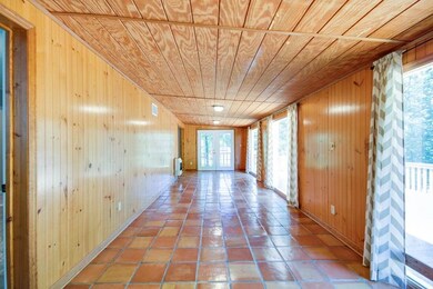 28x10 living room with gorgeous Mexican tile floor and don't miss the beautiful ceiling.