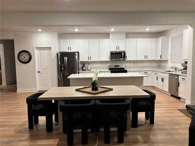 Kitchen with light wood-style floors, a kitchen is