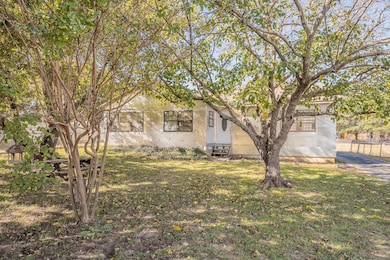 View of front of home with stucco siding and entry steps