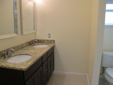 Master bath has walk in shower, double sink, granite counter, new mirrors, tile floor
