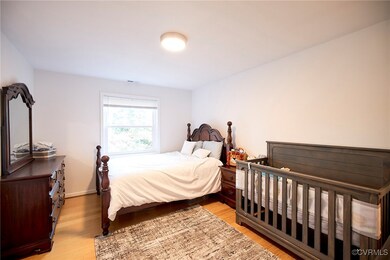 Bedroom with light hardwood / wood-style floors