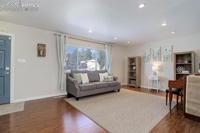 Living room featuring dark hardwood / wood-style f